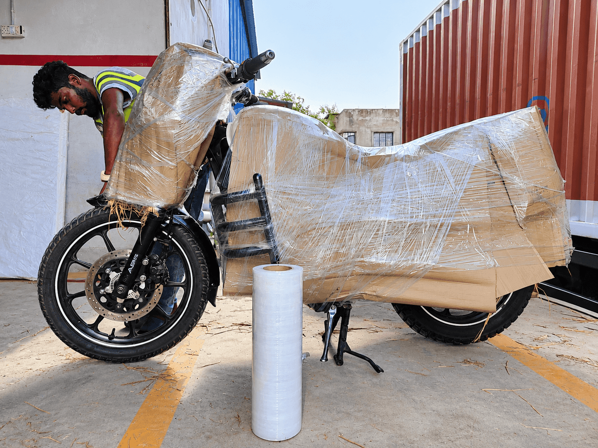 Professional movers wrapping household items safely with high quality packing materials